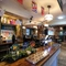 Interior dining area of a pub with a bar.