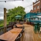 The exterior beer garden seating area and rear of the venue The Two Greens.