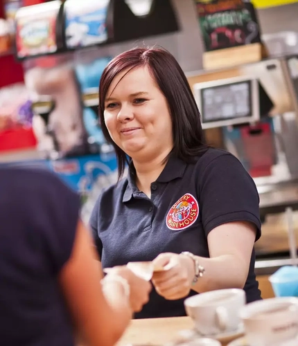 A team member helping a guest