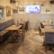 Interior dining area of a pub with a TV.