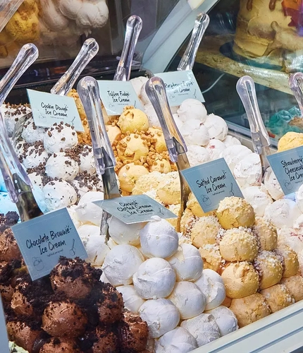 various flavours of ice cream labelled at ice cream counter