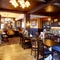 The interior restaurant seating area with TV, at The Good Intent in Hornchurch.
