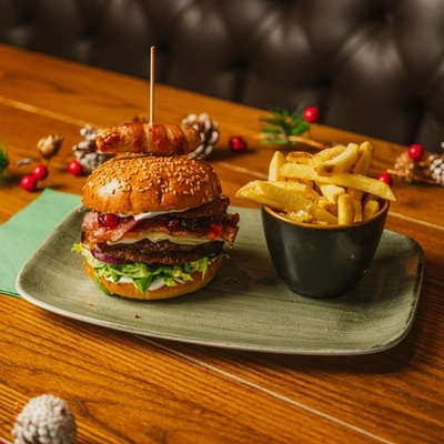A festive main of Festive Beef Melt Burger served in the restaurant at a Community Social venue.