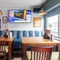 An interior shot of the restaurant, sport and seating area at the Waterside in Shoreham-By-Sea.