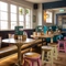 An interior restaurant seating area at The Royal Oak; with wooden flooring, and a long, padded bench seat against the window wall.