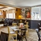 The interior restaurant seating area with TV, at The Fox and Crown in Sutton-in-Ashfield.
