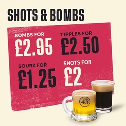 A graphic banner promoting drinks deals on shots and bombs at Flaming Grill venues.