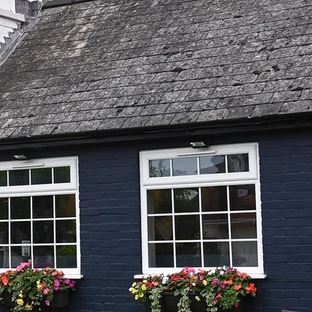 Exterior facade of a pub with a seating area.