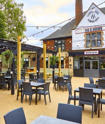 The exterior facade and beer garden seating area at The Fox and Crown in Sutton-In-Ashfield.