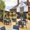 The exterior facade and beer garden seating area at The Fox and Crown in Sutton-In-Ashfield.