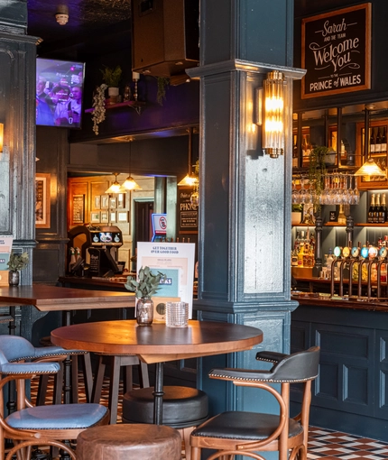 Some tables next to the bar in the Prince Of Wales.