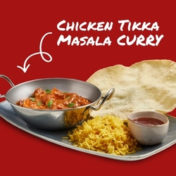 A banner promoting the Chicken Tikka Masala Curry at Hungry Horse venues, showing the curry in a balti dish, served on a tray with rice, a poppadom and a small pot of sauce.
