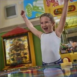 A child playing in the indoor play area at Farmhouse Inns