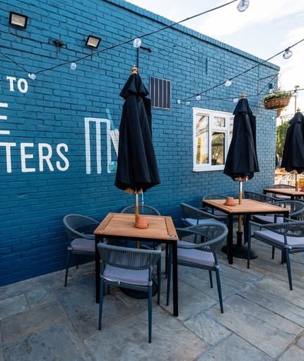 Exterior and beer garden of the Cricketers pub in Southwick