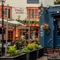 The exterior facade and beer garden seating area of The Sussex Arms.