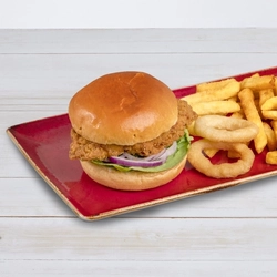 A chicken burger served on a plate with chips and onion rings, at Hungry Horse venues.