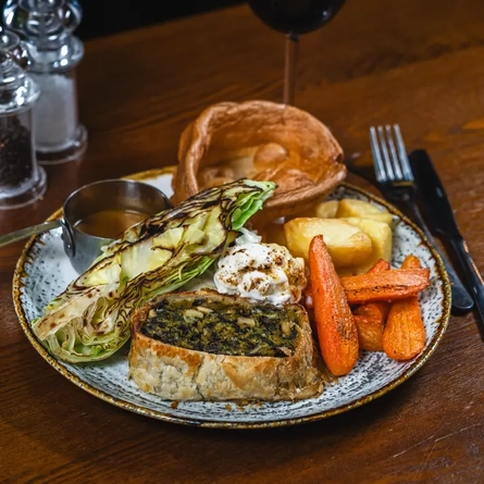 A vegetarian roast dinner on a table.