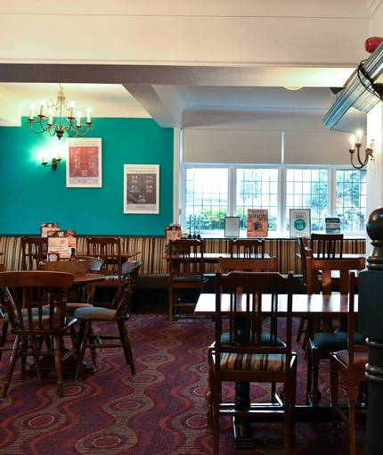interior dining area of a pub with a TV