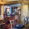 Interior dining area of a pub with a bar.