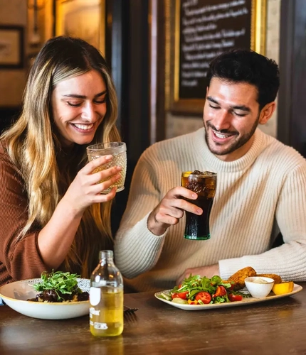 A couple enjoying a meal in the pub