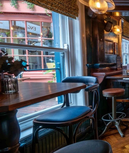The bar and interior seating area of The Sussex Arms in Brighton.