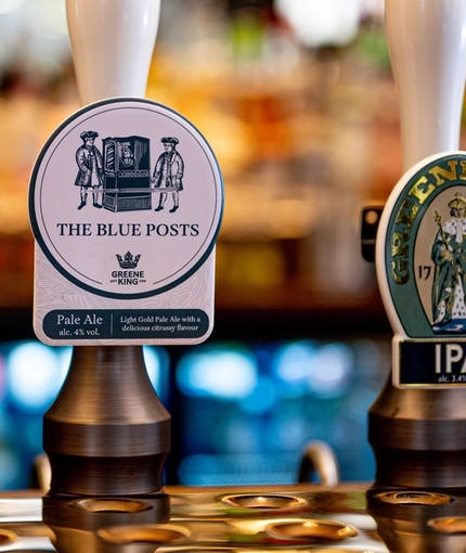 The interior bar focusing on various pumps at The Blue Posts.