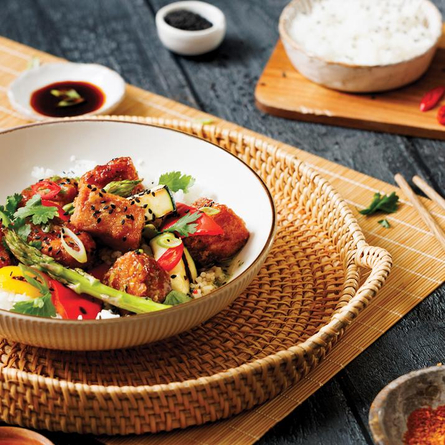 a table full of Asian dishes