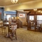 The interior restaurant and seating area with self service coffee machine and sauce and cutlery station at the Snipe.