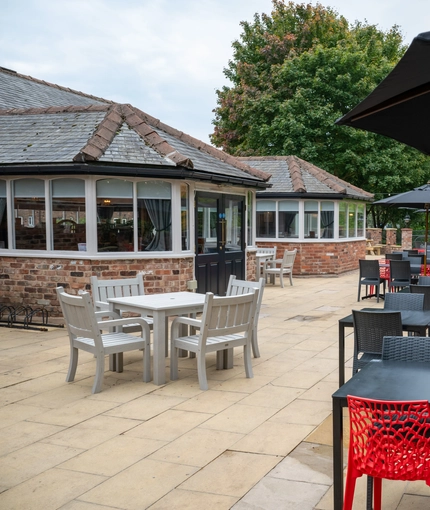The exterior beer garden seating area with shade umbrellas, at The Stanley Ferry.