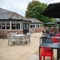 The exterior beer garden seating area with shade umbrellas, at The Stanley Ferry.