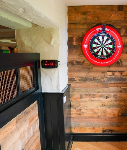 The interior games area with dart board at the Pack Horse.