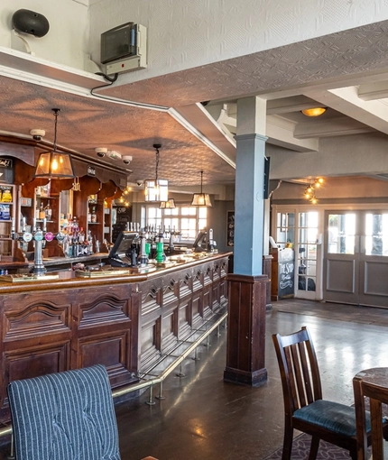 The bar and interior restaurant seating area of The Ship in Mortlake.