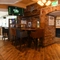 Interior dining area of a pub with a TV.