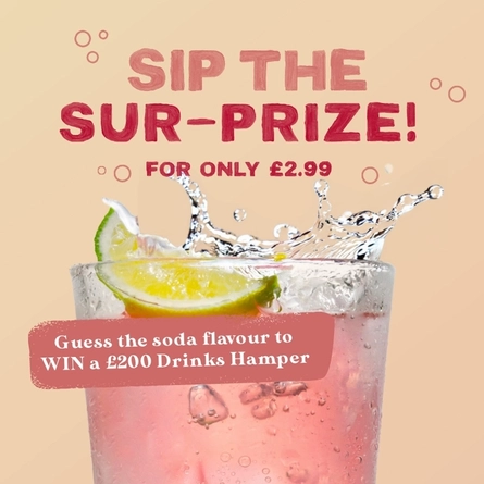 A banner showing a piece of lime falling into a pink coloured drink to advertise a Mystery Soda competition with a chance to win a drinks hamper at Farmhouse Inns venues.