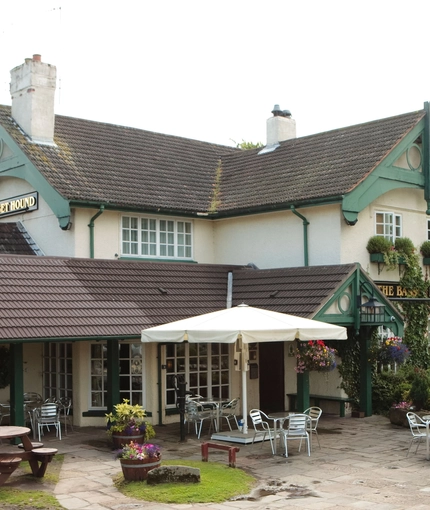 exterior facade of a pub with a seating area