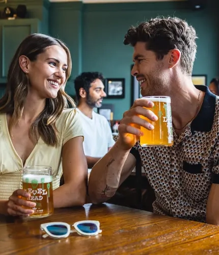 Two guests enjoying a pint of beer