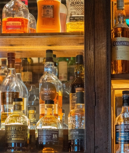 The interior bar area focusing on the spirits at the Ubiquitous Chip.
