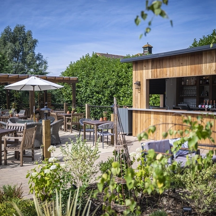 The exterior bar and beer garden seating area at The Boathouse.