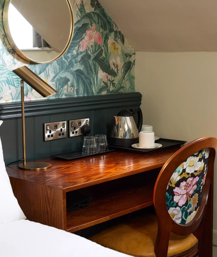 A desk in a hotel room of The Narborough Arms.