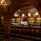 An image showing the interior bar area with wooden gothic arched carvings and stone vaulted ceiling at The Watergates Bar.