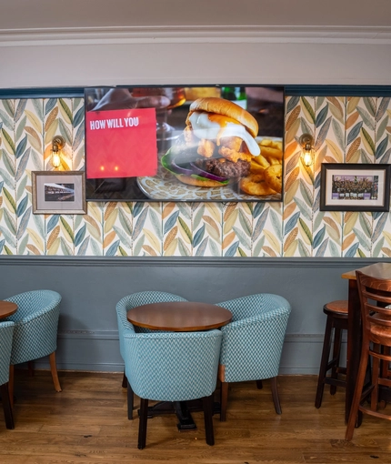 The interior restaurant and seating area with TV at the Dragon.