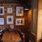 An image of one of the tables within the interior restaurant seating area with fireplace at The Guild.