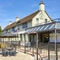 The exterior facade, signage and seating area of The Good Intent in Hornchurch.