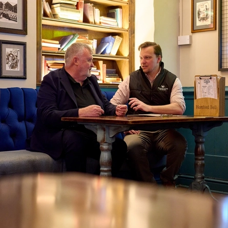 A Pub Partners image showing 2 people sat at a table at the Hertford Bell.