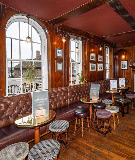 interior of the restaurant with a seating area 