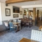 Interior dining area of a pub with a TV.