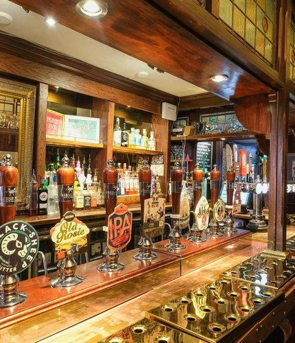 A close up view of the bar taps at Ye Olde Starre Inne.