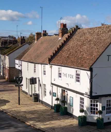 An aerial view of the exterior facade of The Fox, with a view of the rest of the street.