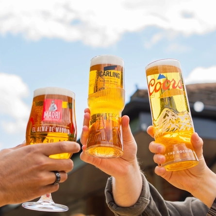 An exterior shot of people enjoying alcoholic drinks served in a beer garden at the Mill House in Stretton.