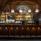 An image showing the interior bar area with wooden gothic arched carvings and stone vaulted ceiling at The Watergates Bar.